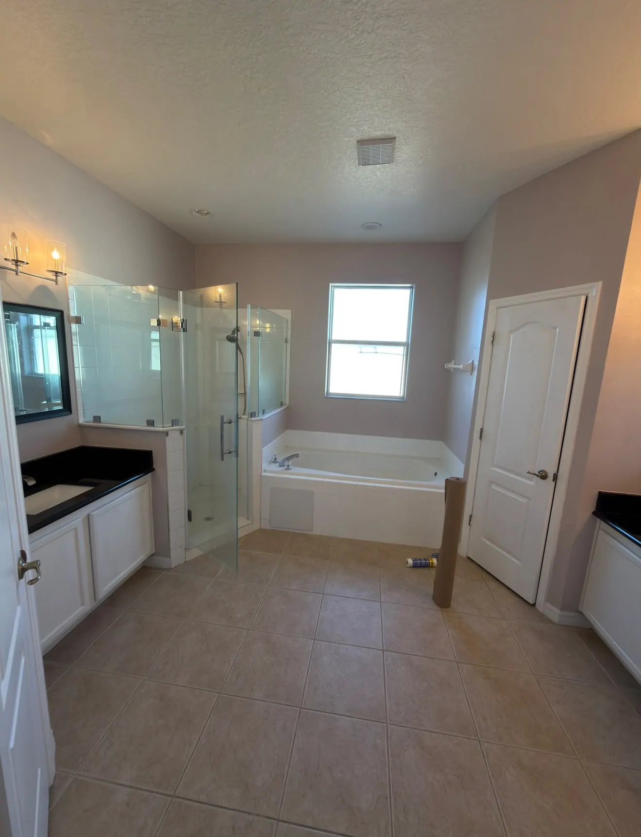 Dated primary bathroom with corner jacuzzi tub before remodeling