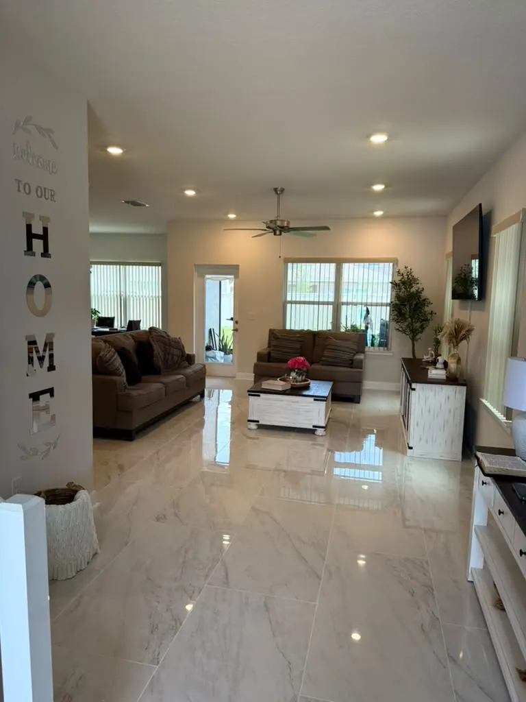 Finished living area with a polished large-format porcelain floor